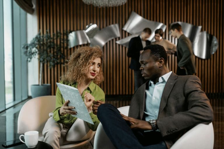 Business colleagues discussing ideas in a modern office setting.