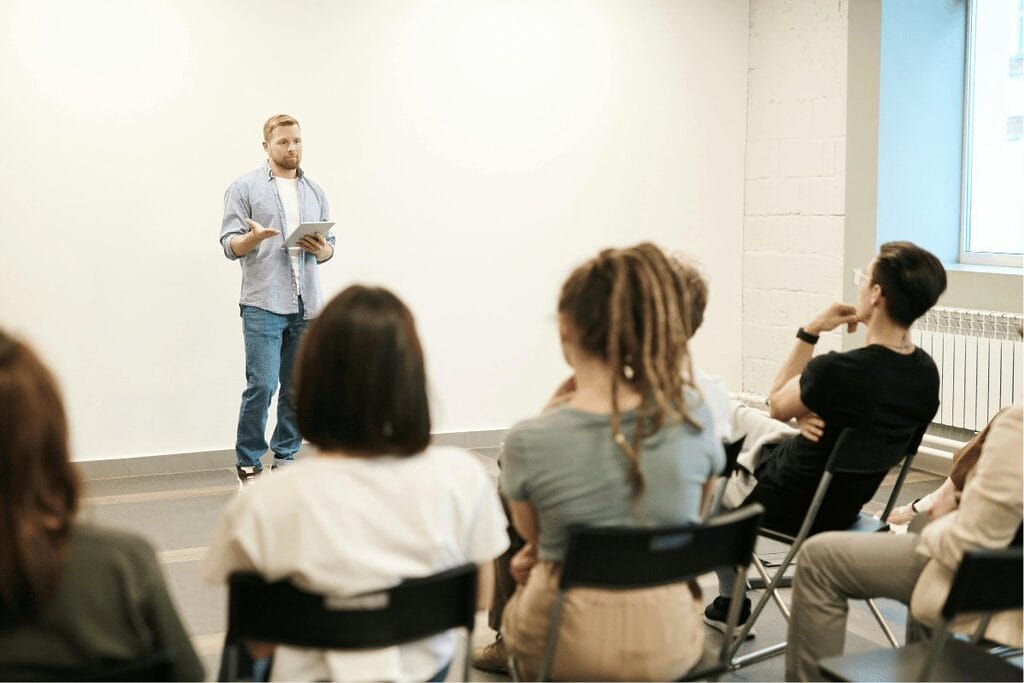 Man giving a presentation to an attentive audience.