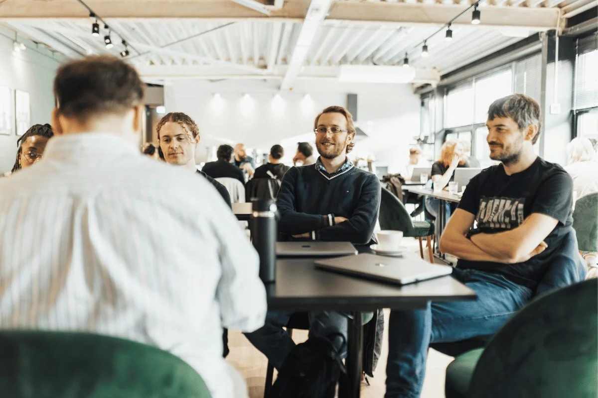 Team members having a casual meeting in a modern office.