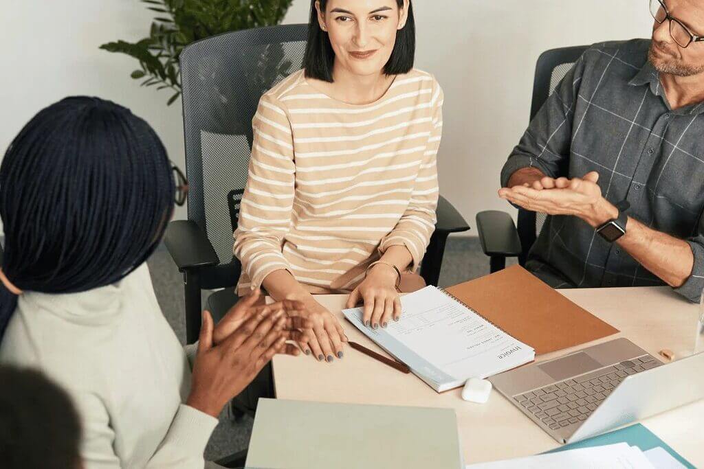 Team members engaging in a discussion during a meeting.