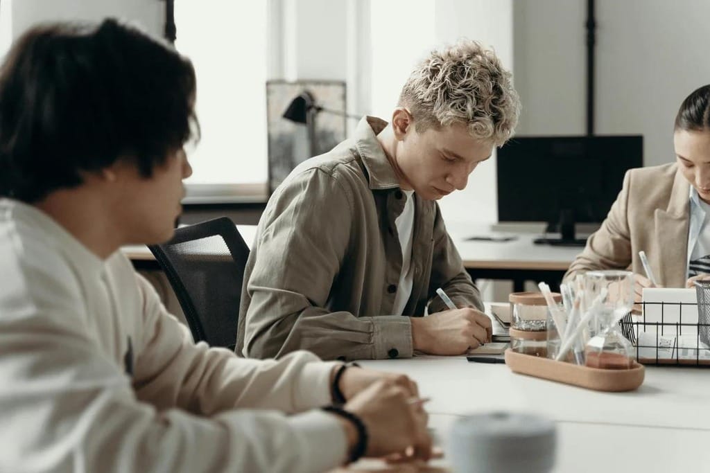 Team members working together in a modern office setting.