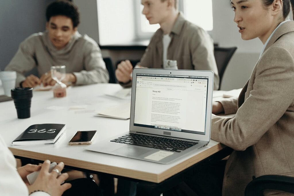 Group of young professionals collaborating on a project in a modern office.