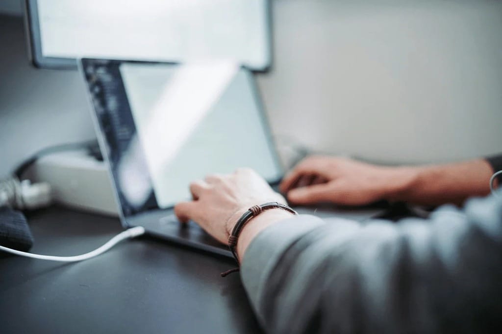 Creative professionals using a laptop in an office.