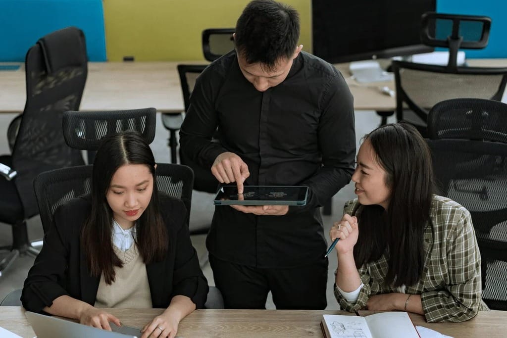 Office team reviewing important documents on a laptop.
