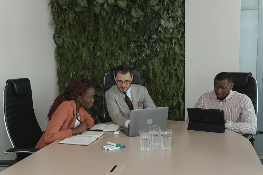 Team members in a meeting discussing growth strategies with a presentation.
