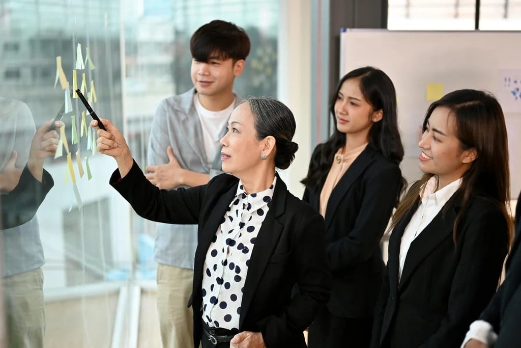 Business meeting with a focus on statistical data presentation.